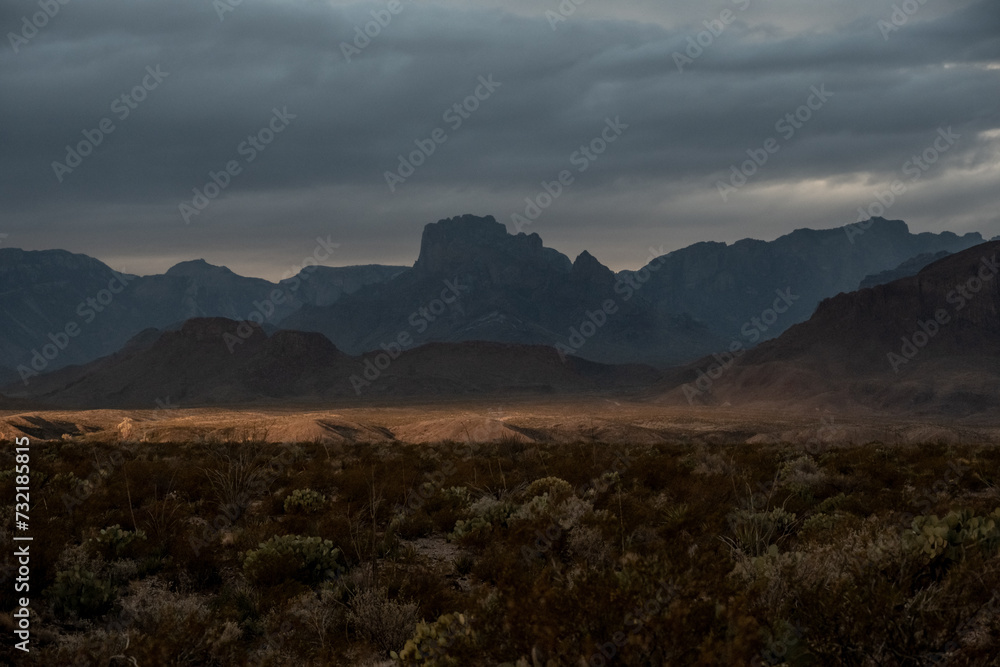 Sun Fills The Valley Below With The Chisos Mountains In Shadow