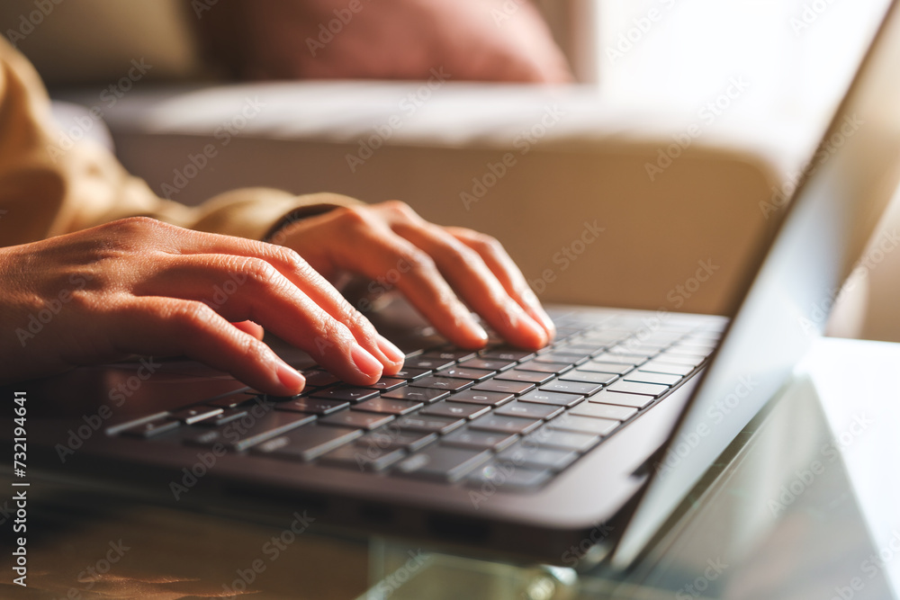 Closeup image of hands working and typing on laptop computer at home Closeup image of hands working and typing on laptop computer at home