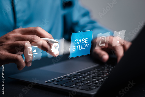 Case study education concept. Businessman use laptop with virtual case study icon for analysis of the situation to find a solution. photo