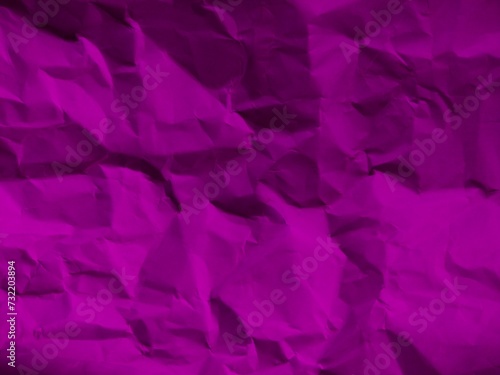 Purple crumpled paper background with copy space.