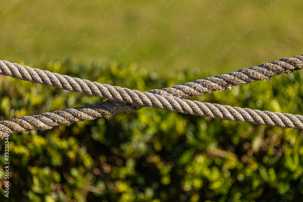 Close-up of rope on blurred background, old frayed boat rope Close-up of rope on blurred background, old frayed boat rope