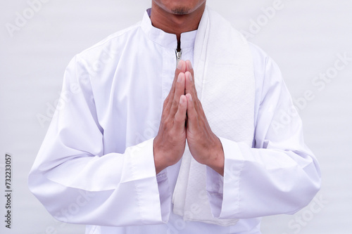 Asian Muslim man giving greetings to welcome the Ramadan celebration photo