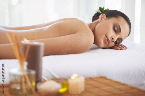 Relax, peace and woman at spa for massage, skincare or calm at table to rest for aromatherapy at luxury resort. Beauty, therapy and person at salon for healthy body, treatment or pamper for wellness