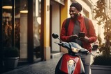 Smiling man with scooter using smartphone