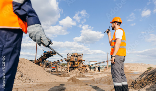 Photos Industry banner, worker Man use walkie talkie on sand quarry background belt con