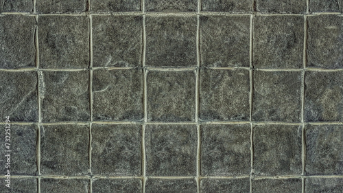 Dark gray tile wall for seamless tiles background and texture.