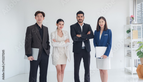 Portrait business team woman and man asian group meeting standting on wall wtite looking hand holding laptop and notebook ready for happy working online sale inside home office wall white background photo