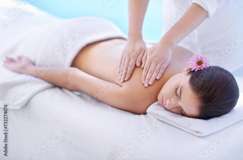 Sleep, spa and woman at pool for massage with health, wellness and luxury holistic treatment. Self care, peace and girl on table with professional masseuse for body therapy, relax and hotel service