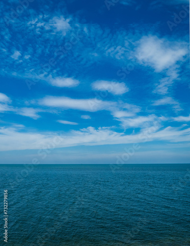 Landscape beautiful summer vertical horizon look view tropical shore open sea beach cloud clean and blue sky background calm nature ocean wave water nobody travel at  thailand chonburi sun day time © Singh