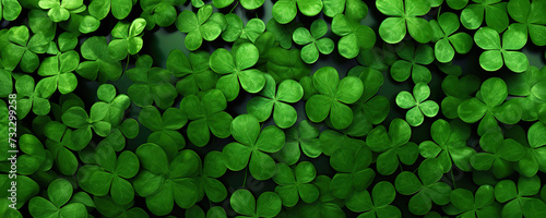 A plethora of green leaves comprising a four-leaf clover pattern