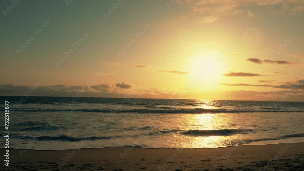 Big ocean waves hitting across huge stones with birds flying over during the sunset. Giant water splashed. California beach at sunset with romantic dusk view. Wonderful nature in slow motion. Big ocean waves hitting across huge stones with birds flying over during the sunset. Giant water splashed. California beach at sunset with romantic dusk view. Wonderful nature in slow motion.