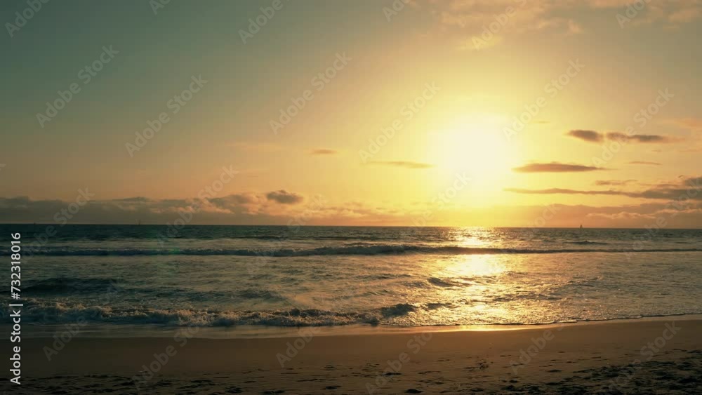 Venice beach at sunset with romantic sunrise view. Relaxing scenic view with a sun going down the horizon. Colorful nature with ocean view and warm sunlight reflection on water. Slow motion. Venice beach at sunset with romantic sunrise view. Relaxing scenic view with a sun going down the horizon. Colorful nature with ocean view and warm sunlight reflection on water. Slow motion.