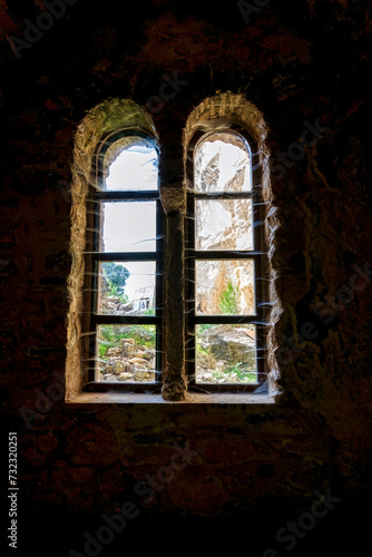 Windows inside the monastery enclosed by Davelis cave in Penteli  a mountain to the north of Athens  Greece