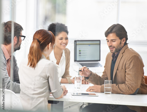 Businessman, meeting and planning with team in finance, brainstorming or coaching with documents at office. Man or manager talking to group of employees for financial growth or revenue at workplace