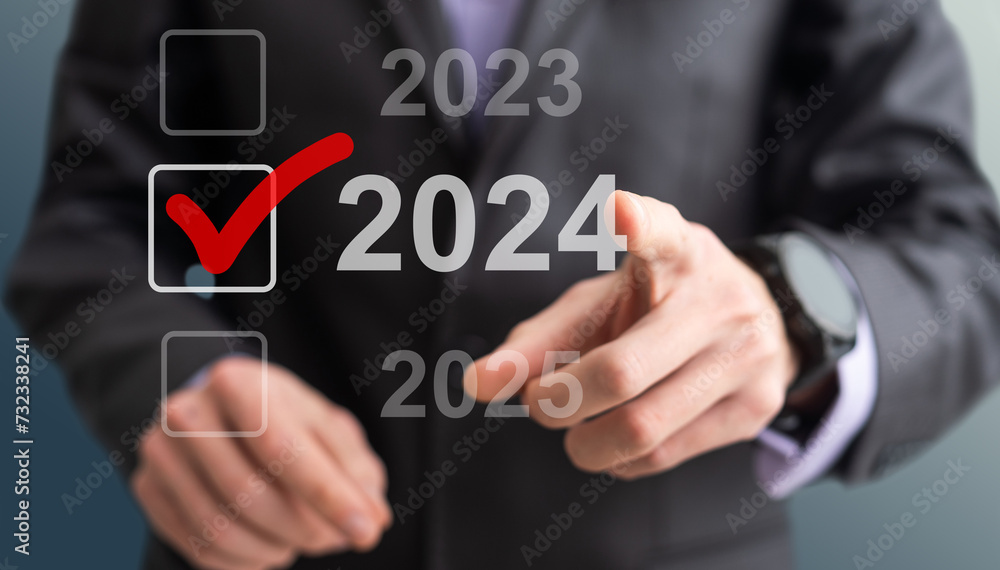 Businessman pressing virtual button New 2024 Year Businessman pressing virtual button New 2024 Year
