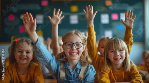 Joyful Classroom Interaction, cheerful young students actively participate in class, hands raised, with a blackboard in the background, exemplifying enthusiasm in education © Anastasiia