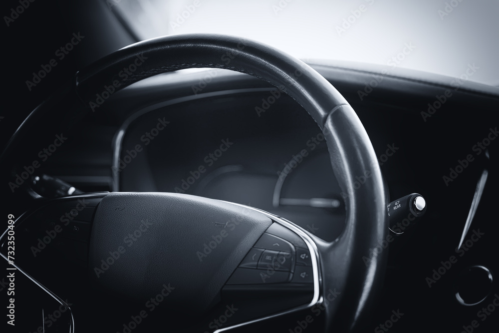 Modern car cockpit dashboard close-up.