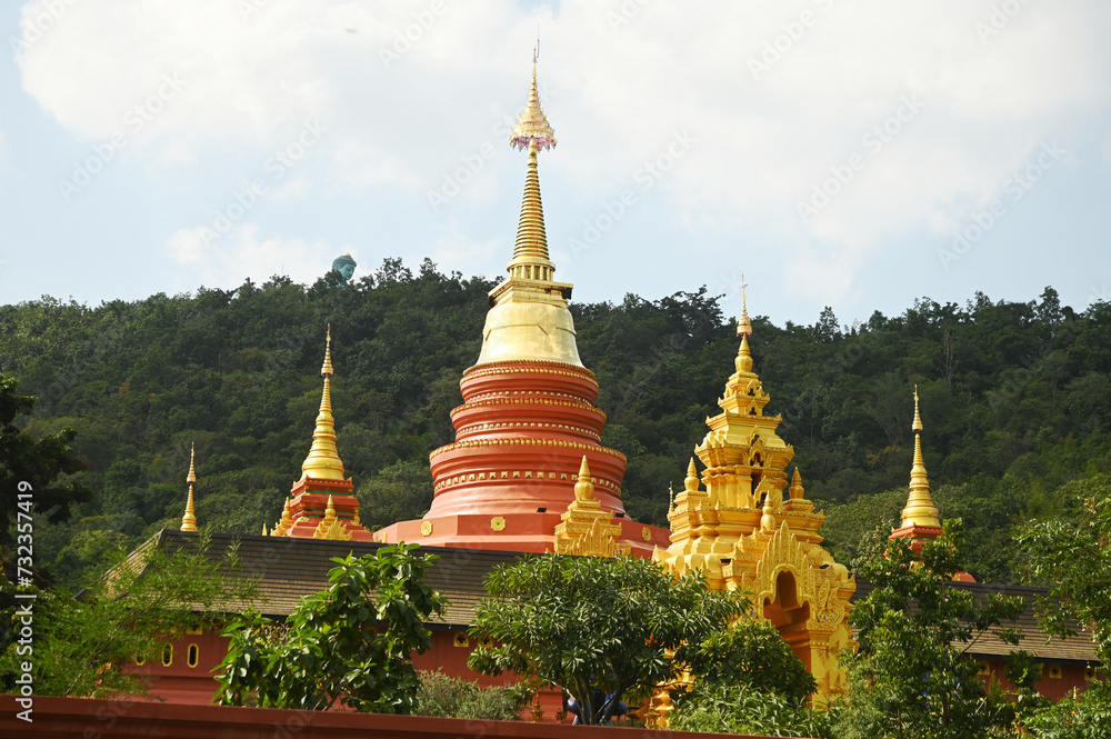 Naklejka premium Outdoor golden pagoda Wat Phra That Doi Phra Chan is a temple located on a secluded mountain called Doi Phra Chan, offering beautiful views and scenery. Located at Lampang Province in Thailand.