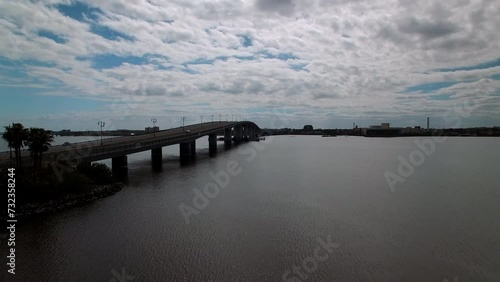 Wallpaper Mural Aerial Ascending Shot Of Cars Moving On Segmental Bridge In City, Drone Flying Forward Over Halifax River On Sunny Day - Daytona Beach , Florida Torontodigital.ca