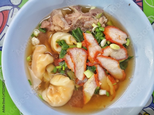 Thai food, Thai street food, noodles with pork and dumplings with pork.