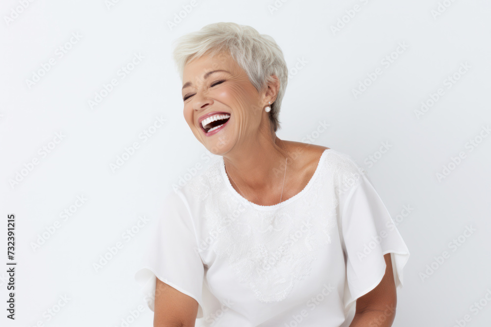 Joyful mature woman laughing in casual outfit. Positive emotions and vitality. Joyful mature woman laughing in casual outfit. Positive emotions and vitality.