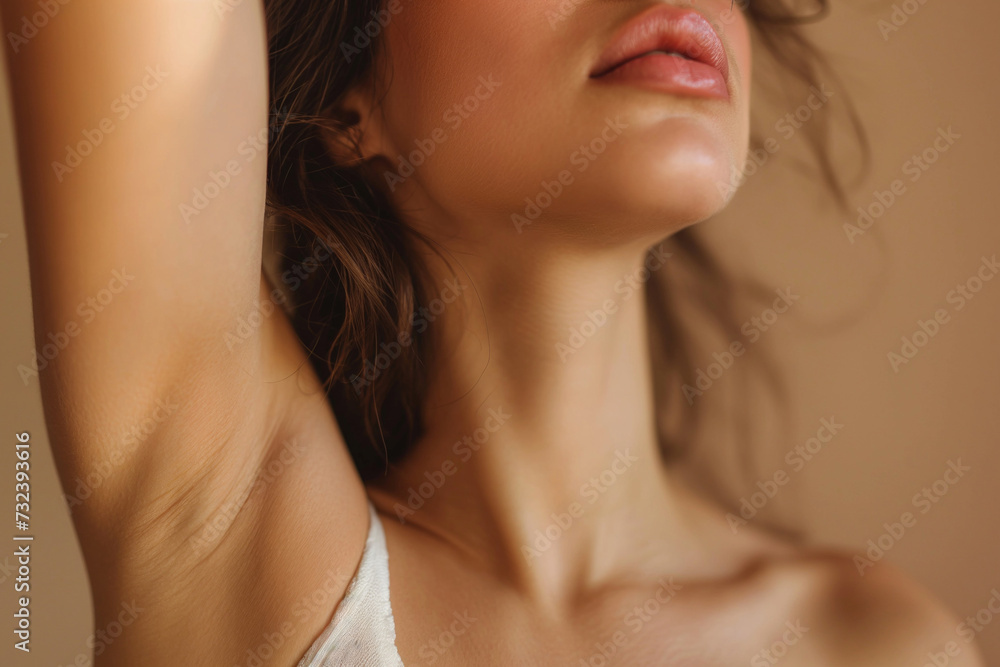 A young Caucasian woman shows her shaved armpit. Body care concept A young Caucasian woman shows her shaved armpit. Body care concept