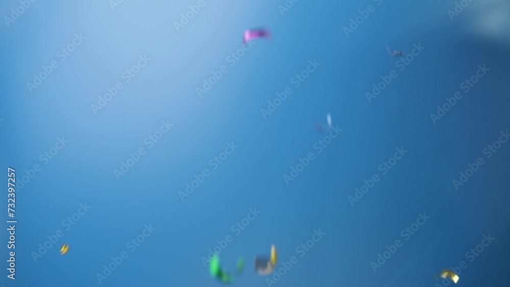 Confetti falling on a blue background, festive celebration, party decor, carnival atmosphere Confetti falling on a blue background, festive celebration, party decor, carnival atmosphere