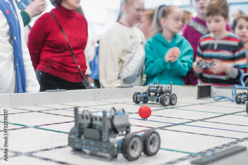 robot competitions, children control robots. High quality photo