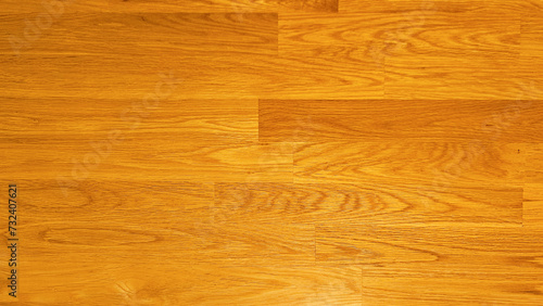 Warm oak wood flooring with a seamless pattern, highlighting the natural grain and golden hues of the wood