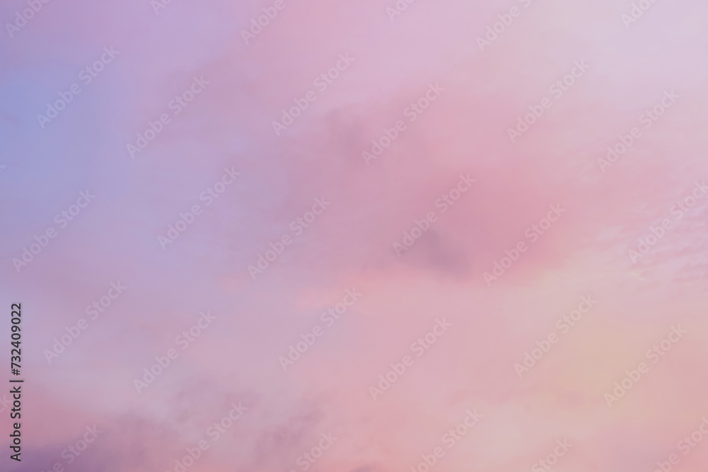 Twilight sky with effect of light in pastel pink, coral, orange, blue tones. Colorful sunset of soft clouds. Background Twilight sky with effect of light in pastel pink, coral, orange, blue tones. Colorful sunset of soft clouds. Background