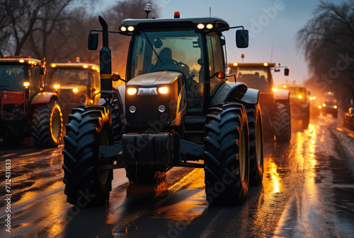 Convoy of Modern Agricultural Tractors on a Wet Road at Twilight, Representing Farming Machinery in Action During Seasonal Fieldwork