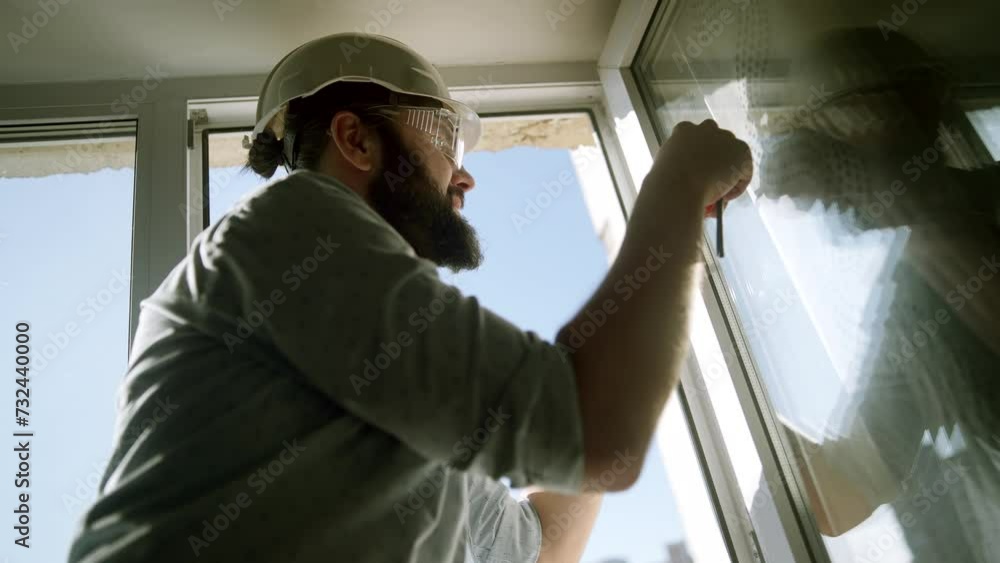 Builder installs plastic windows and furniture Builder installs plastic windows and furniture