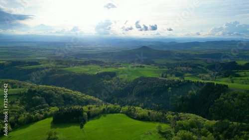 Obraz na plátně Captivating aerial view of the green valley with lush vegetation and hills