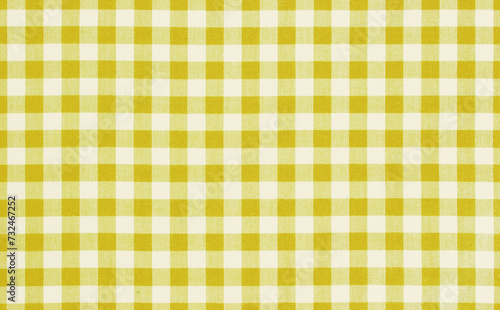 Yellow checkered textile background,picnic cloth texture.Food advertisement background.