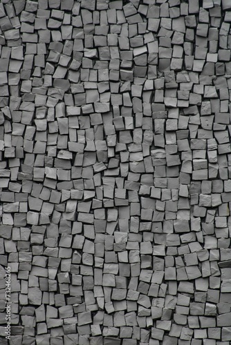 gray tiles on the wall made up of tiny squares and blocks