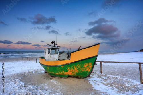 Fototapeta Naklejka Na Ścianę i Meble -  Fishing boats on the Baltic Sea beach in Jantar at winter. Poland