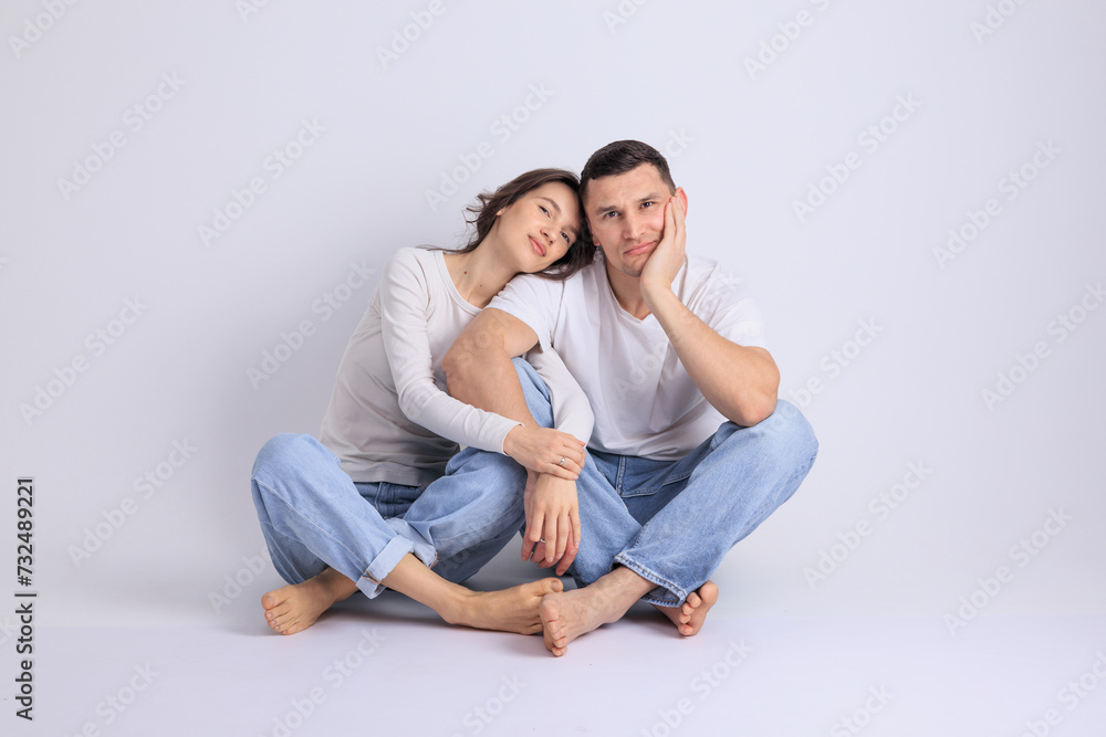 This captivating minimalist portrait features a couple in a quiet embrace, bathed in soft light. This captivating minimalist portrait features a couple in a quiet embrace, bathed in soft light.