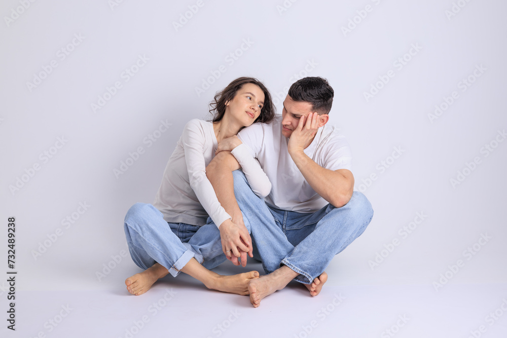 This captivating minimalist portrait features a couple in a quiet embrace, bathed in soft light. This captivating minimalist portrait features a couple in a quiet embrace, bathed in soft light.