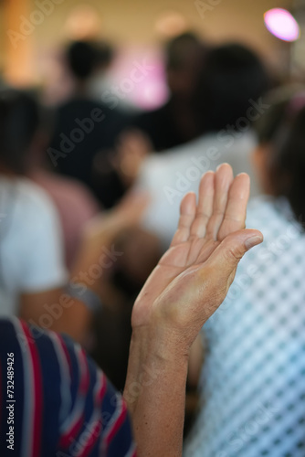 Human raising hand worshiper at Church. © NoonVirachada