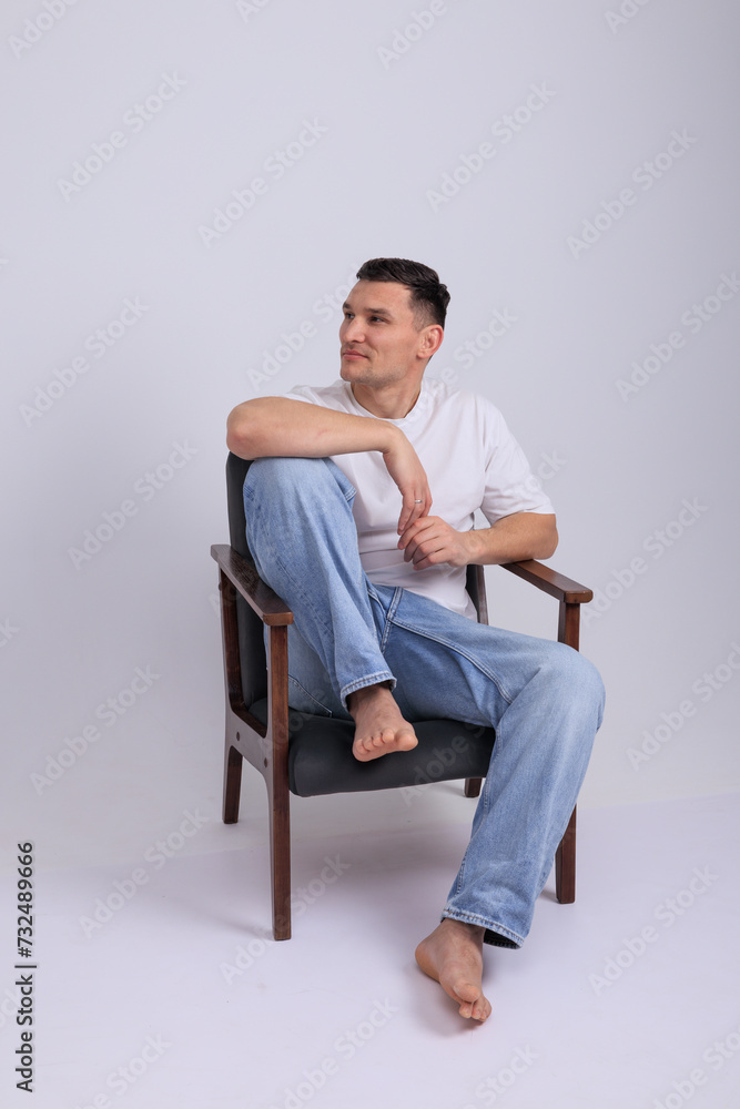 In this captivating minimalist portrait, a man emanates strength and quiet confidence. In this captivating minimalist portrait, a man emanates strength and quiet confidence.