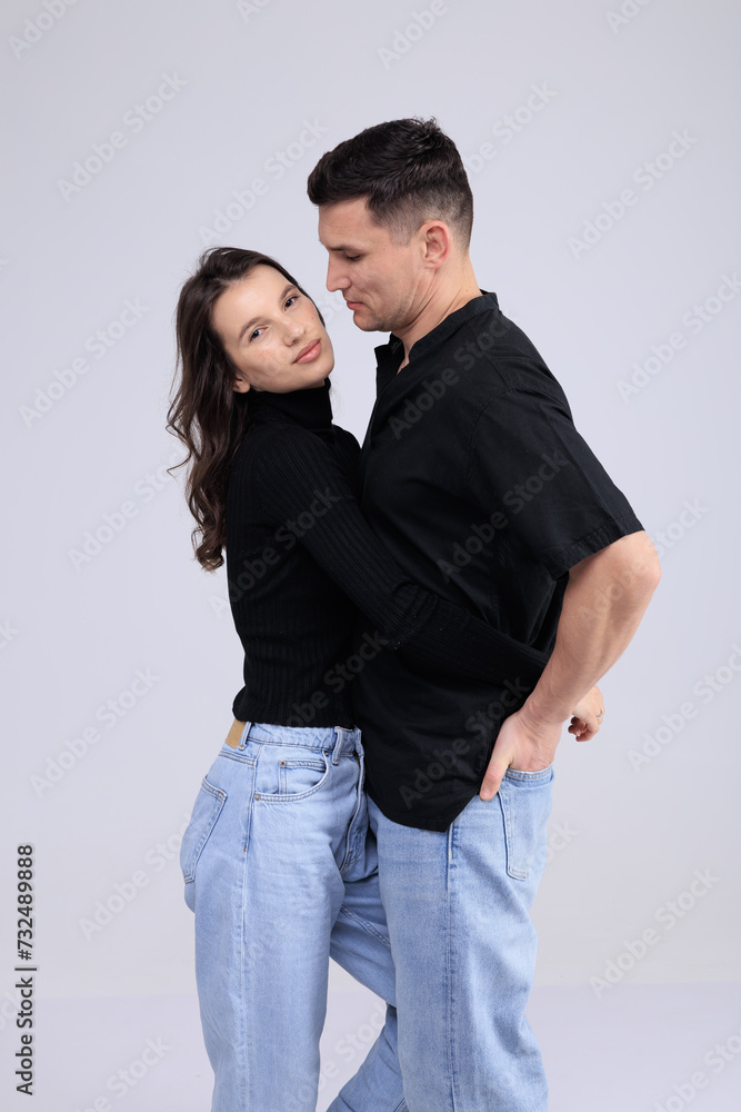 This captivating minimalist portrait features a couple in a quiet embrace, bathed in soft light. This captivating minimalist portrait features a couple in a quiet embrace, bathed in soft light.