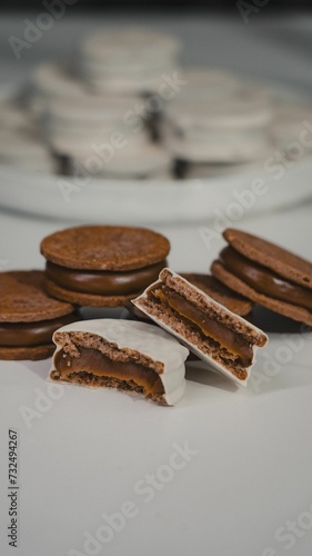 Close-up of fresh homemade chocolate cookies on a white table