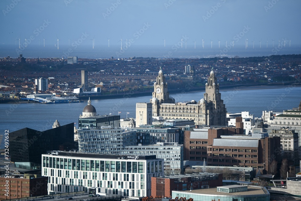 Fototapeta premium the skyline of liverpool in england with some buildings and the water