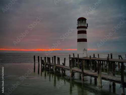 Scenic view of the lighthouse and the pier on the frozen lake