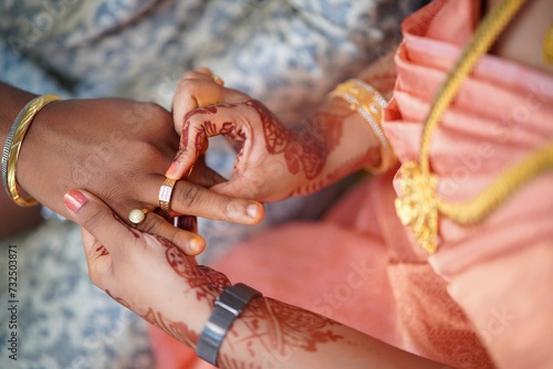 Hands of a couple just getting married