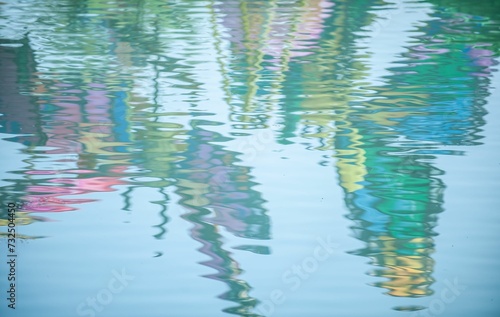 Fotografie Scenic view of flowers reflecting on a tranquil pond surface