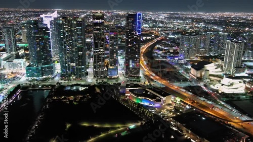 Aerial shot top of Miami downtown bulldings and traffic on freeway, financial district at night photo