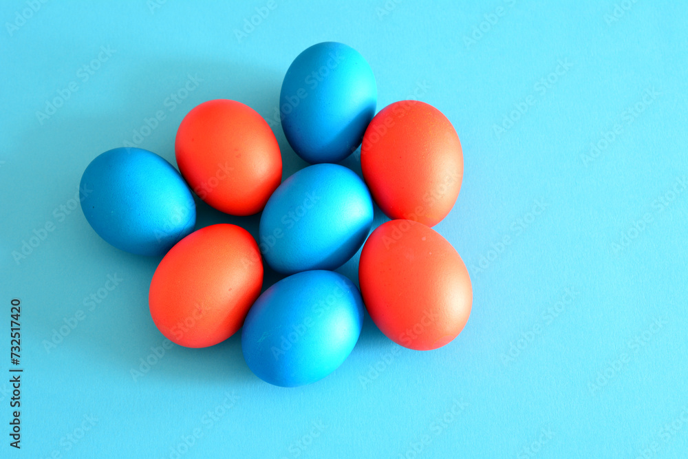 painted blue and red easter eggs isolated on blue background painted blue and red easter eggs isolated on blue background