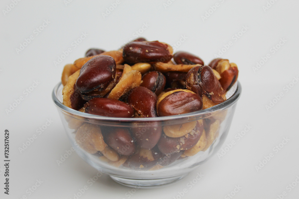 Kacang koro, or cooked jack bean, in a transparent glass bowl, isolated on white background Kacang koro, or cooked jack bean, in a transparent glass bowl, isolated on white background