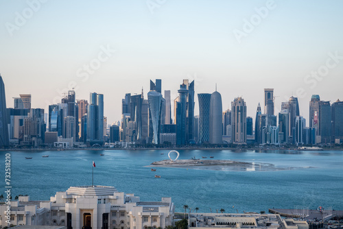 Doha, Qatar - February 3, 2024 -Doha Towers with water in front of them and the Msheireb buildings in the heart of Doha in Qatar photo